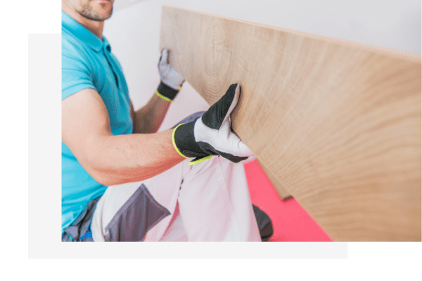 man installing solid timber flooring